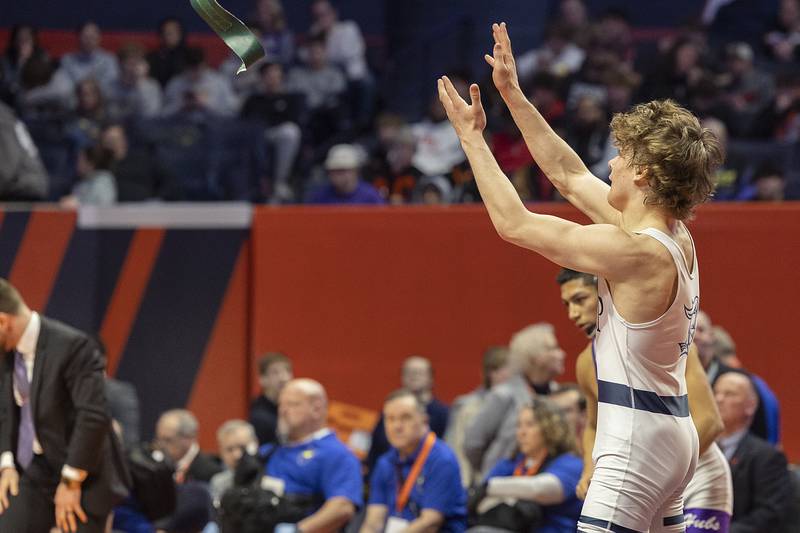 IC Catholic’s Max Cumbee celebrates hit win over Rochelle’s Xavier Villalobos in the 126 pound weight class of the 2A state individual wrestling finals Saturday, Feb. 22, 2025, at State Farm Center in Champaign.