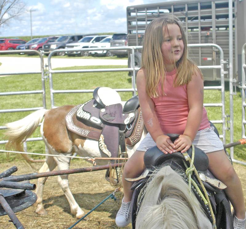Oaklyn Eich of Amboy enjoys a pony ride Sunday, July 27, 2025, at the Lee County Fair near Amboy.
