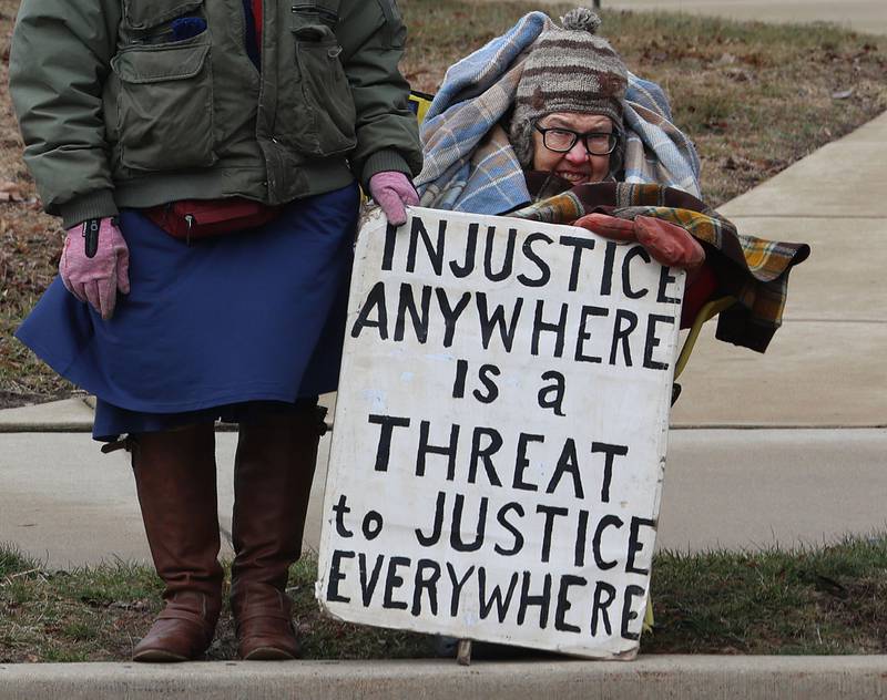 A protester holds a sign during a "ICE Out For Good" protest on Saturday, Jan. 10, 2026 at Rotary Park in Princeton. The Bureau County Democrats organized the event. About two-dozen protesters gathered to protest the ICE officer who shot and killed Renee Nicole Good in Minneapolis on Jan. 7.