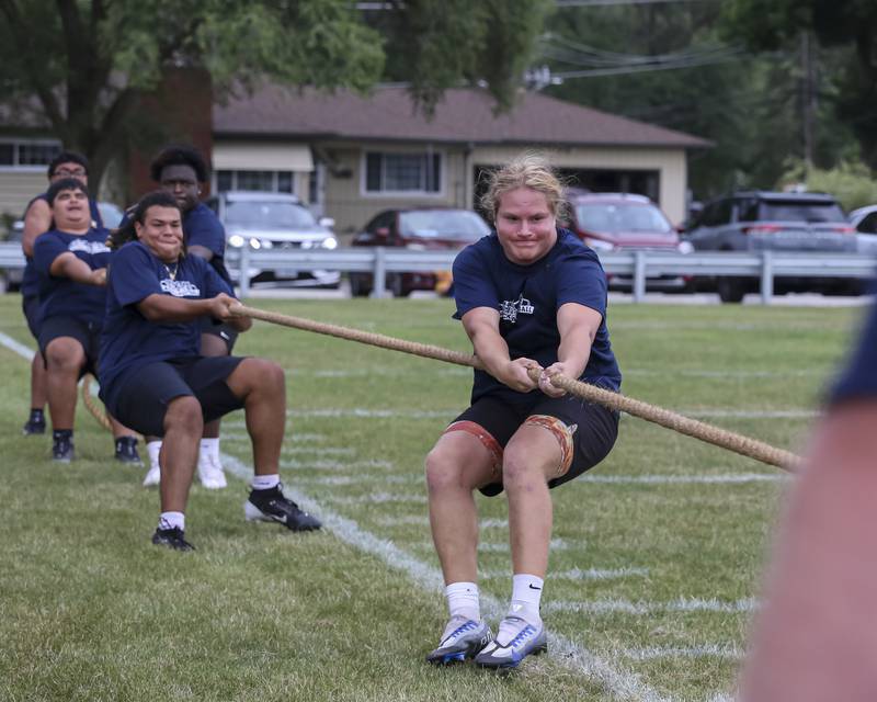 West Aurora' Keiran Duncan leads his team in the Tug of War tournament during the West Aurora "Battle of the Butts" Lineman Challenge, July 10, 2025  in Aurora.