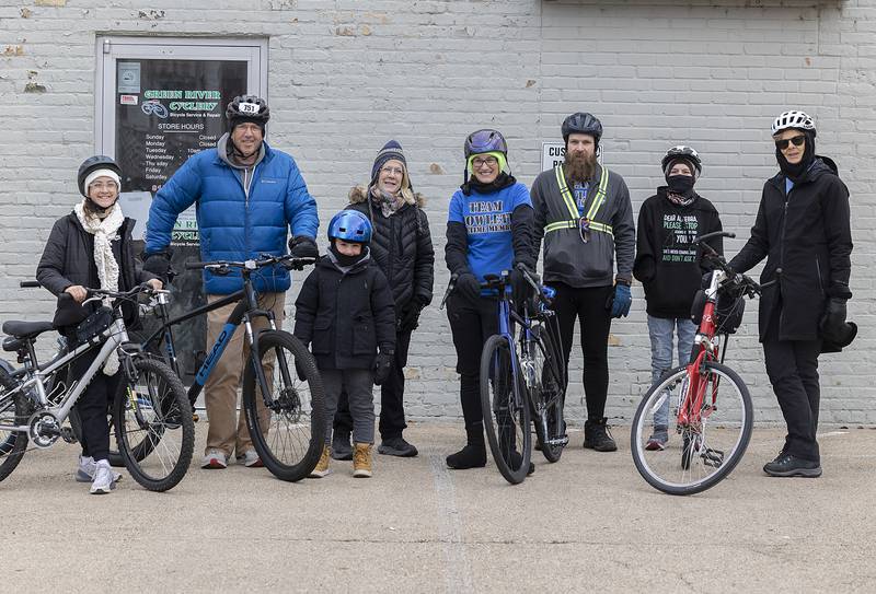 New Year's Day riders Teagan Moore (left), 13; Matt Moore; Bode Moore, 6; Pam Fenwick; Kelly Jackson; Jason Howlett; Shelby Howlett, 14; and Deb Mellen gear up for the annual bike ride Wednesday, Jan. 1, 2025, in Dixon.