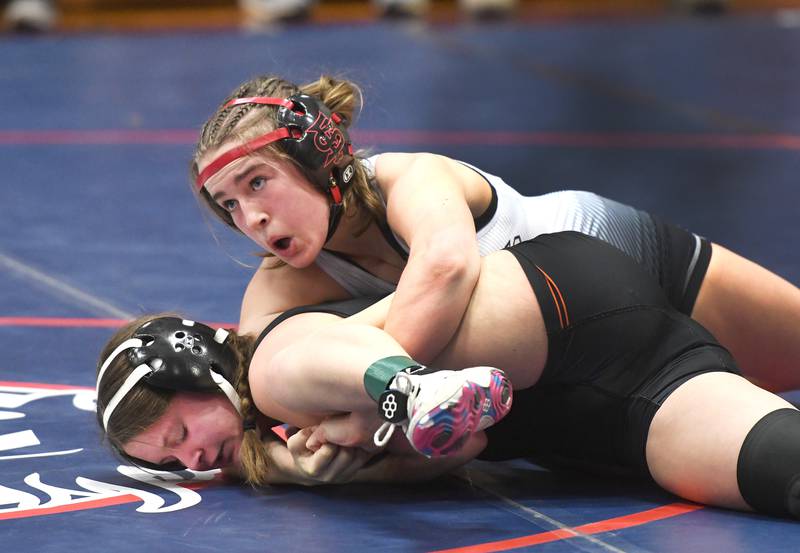 Fulton's Tessa Fosdick holds Byron's  Rylie Dach on the mat during the 115-pound championship match at the Belvidere Regional on Saturday, Feb. 7, 2026.