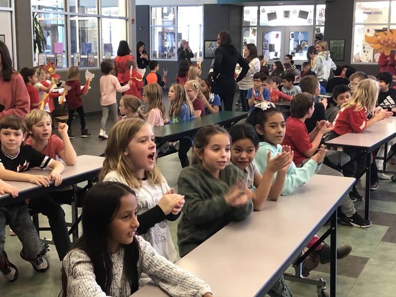 Students at JFK Elementary in Spring Valley cheer for their peers during a parade celebrating Chinese New Year on Friday, Jan 27, 2023.