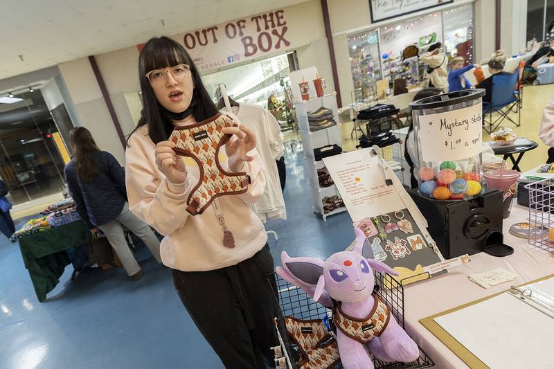 Hope Cantu shows off her hand designed pet harness Saturday, March 4, 2023 at the Northland Mall. Hope teamed up with two other sisters Julia and Domyneque, all of Dixon, to sell a variety of items at a booth.