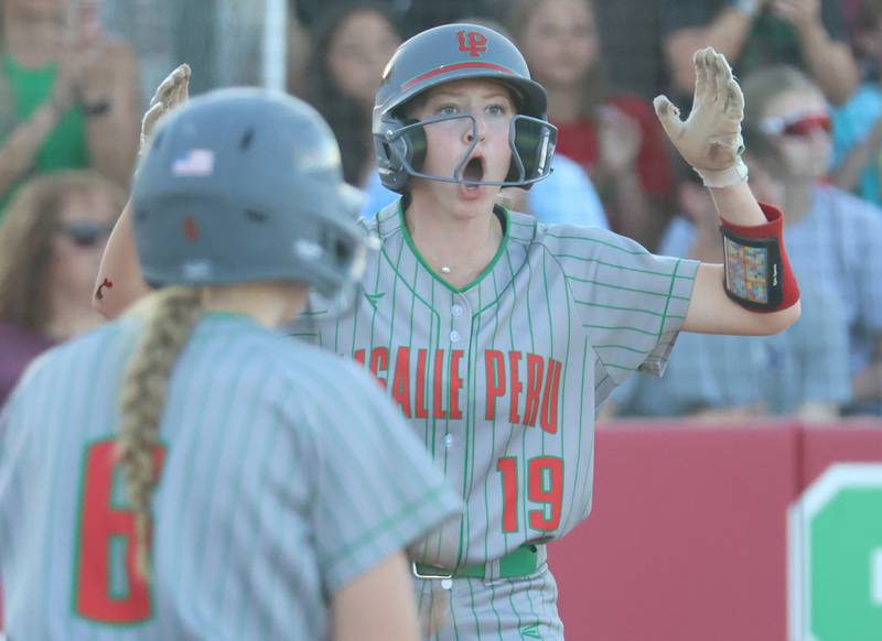L-P's Lydia Steinbach reacts after scoring a run during the Class 3A Sectional semifinal game on Tuesday, May 26, 2026 at the L-P Athletic Complex in La Salle.