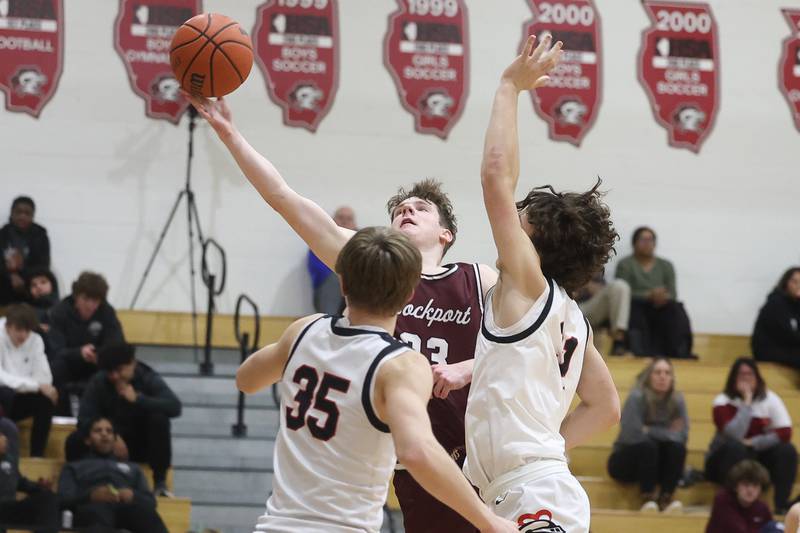 Lockport’s Collin Miller lays in a contested shot against Lincoln-Way Central on Tuesday, Jan. 23rd, 2024 in New Lenox.