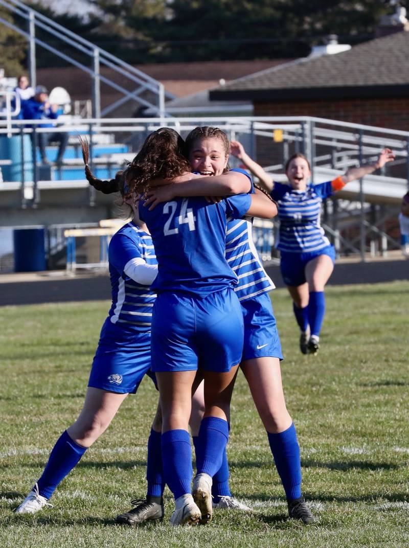 Mariah Hobson gives teammate Olivia Mattingly a hug after she scored a goal Tuesday.
