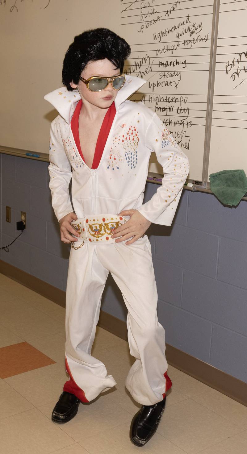 Fifth-grader Nolan Rockey performs a signature Elvis dance move during his performance Tuesday afternoon.