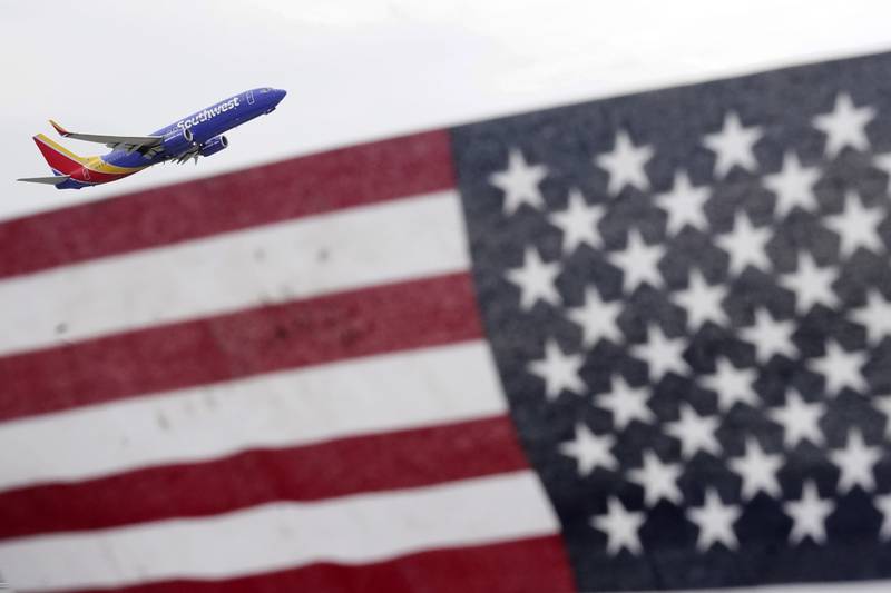 A Southwest Airlines passenger jet takes off at Chicago's Midway International Airport on the first day of the July 4th holiday weekend Friday, July 1, 2022, in Chicago. The July Fourth holiday weekend is off to a booming start with airport crowds crushing the numbers seen in 2019, before the pandemic. (AP Photo/Charles Rex Arbogast)