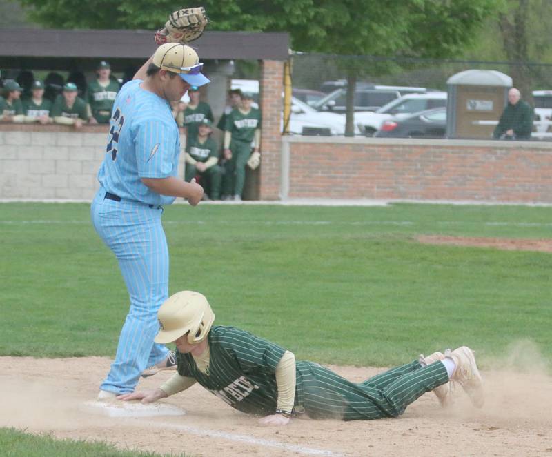 St. Bede's Gus Burr slides back into first base as Marquette's Sam Mitre makes a late catch at Masinelli Field on Thursday, April 18, 2024 in Ottawa.