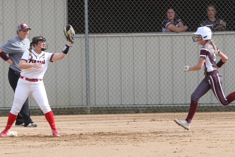 Ottawa's Peyton Bryson makes a catch at first base to force out Morris's Alyssa Jepson on Monday, May 15, 2023 at Ottawa High School.