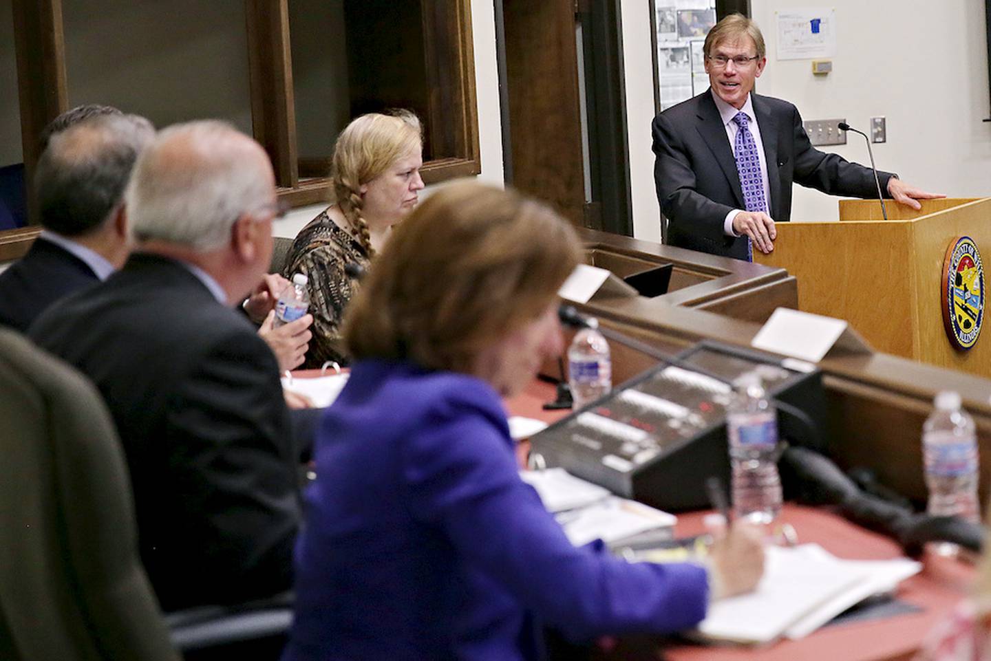 John Greuling (right), president and CEO of Will County Center for Economic Development, speaks Friday about an interest of adding train lines to the Heritage Corridor during the start of a Metra board meeting in Joliet.