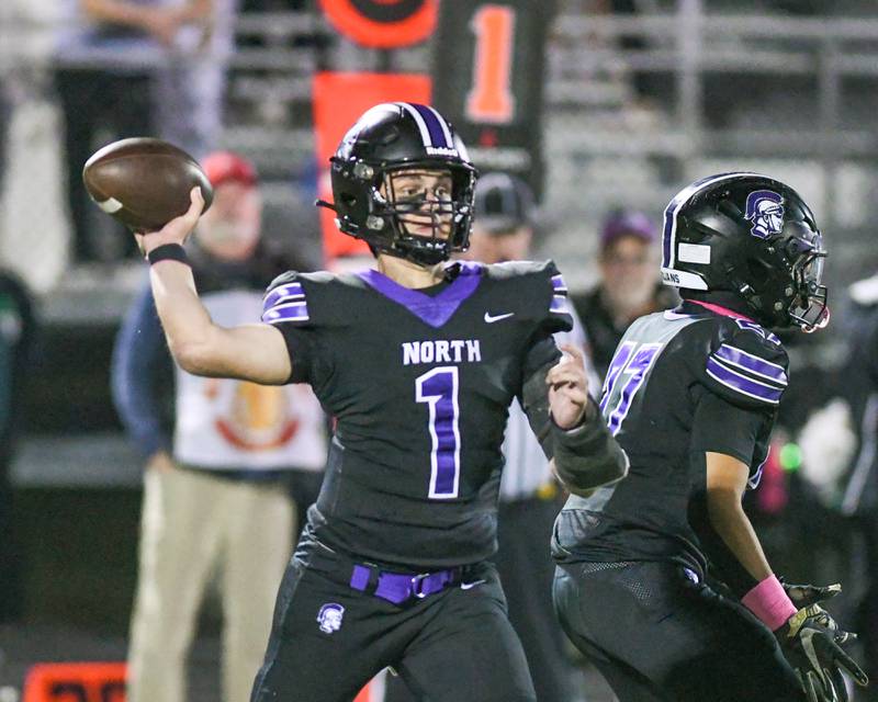 Downers Grove North's Owen Lansu (1) passes the ball during the game on Friday Oct. 10, 2025, while taking on York High School held at Downers Grove North High School.