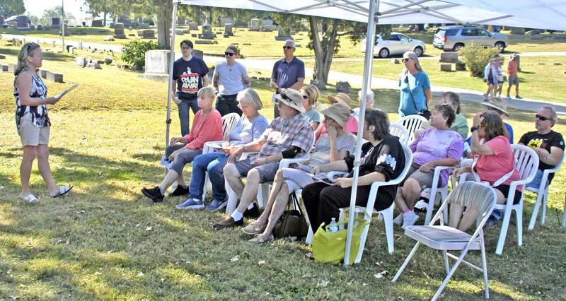 Karen Yardley talks with the crowd about the mausoleum during the Lee County Historical and Genealogical Society's cemetery walk at Oakwood Cemetery in Dixon on Sunday, Sept. 28.