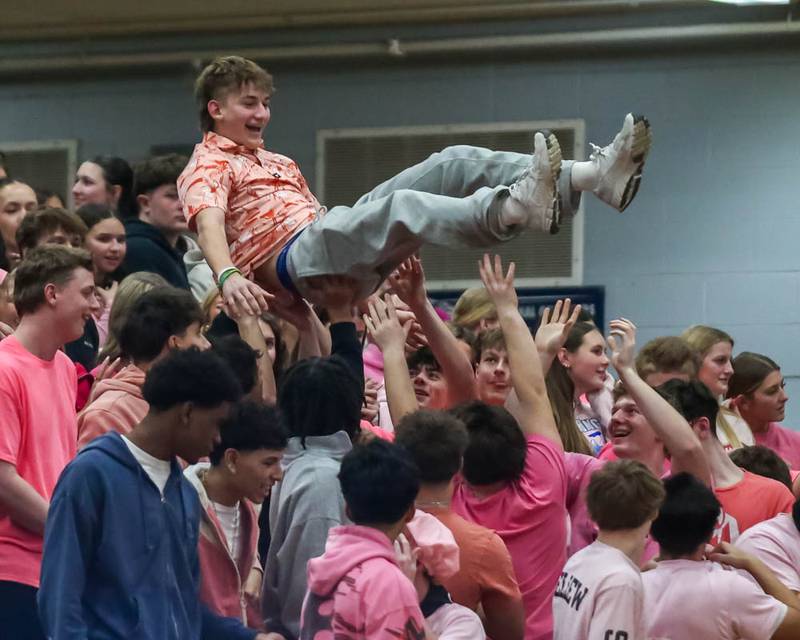 An Oswego student is hoisted in the air during their basketball game between Oswego at Oswego East, Feb 13, 2026 in Oswego.