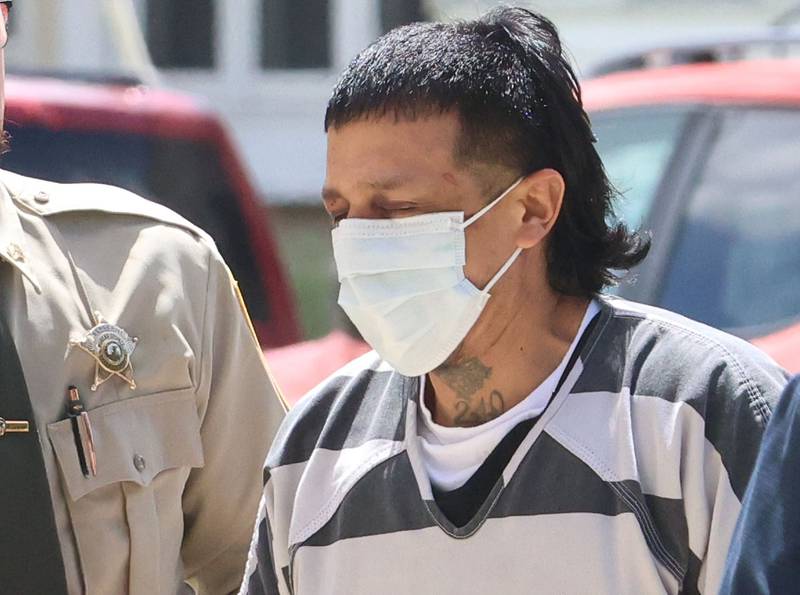 Anthony Daniel Rodriguez (right) walks into the Bureau County Courthouse for an appearance on Wednesday, May 13, 2026 in Princeton. Rodriguez, a 42-year-old man has been charged in connection with a shooting near DePue that killed a 3-year-old child during a domestic disturbance Sunday.