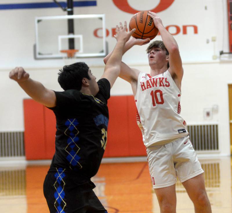 Oregon's Keaton Salsbury (10) shoots against Rockford Christian during the third place game at the Oregon Thanksgiving Tournament on Saturday, Nov. 25, 2023 in Oregon.