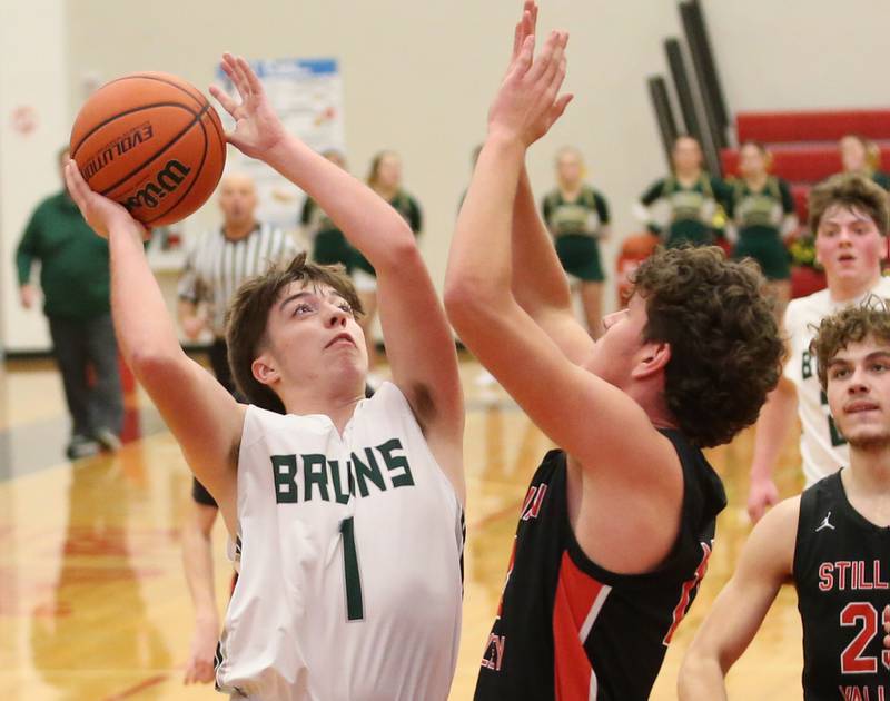 St. Bede's Halden Hueneburg eyes the hoop as Stillman Valley's Ethan Szarkowicz defends during the 49th annual Colmone Class on Thursday, Dec. 7, 2023 at Hall High School.