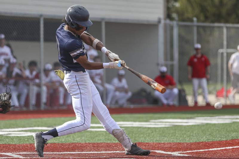 Oswego East's Jacsen Tucker (17) connects on a pitch for a hit during baseball game between Oswego East at Yorkville. Monday, May 12, 2025 in Yorkville.