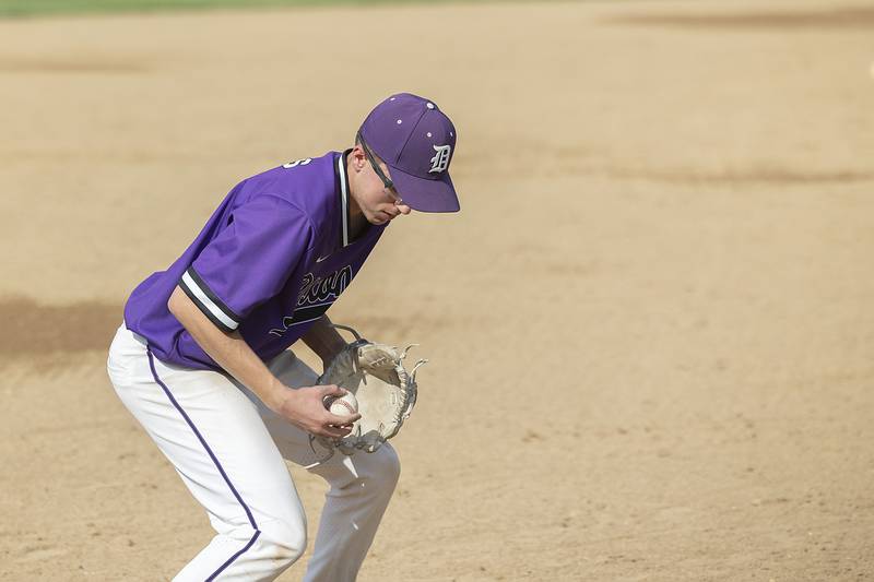 Dixon’s Ari Selmani picks a hot shot at third for an out against Sterling Tuesday, May 16, 2023.