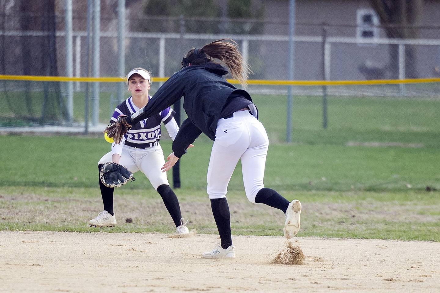Dixon’s Kiley Gaither snags a pop-up against Genoa-Kingston Monday, April 7, 2025.