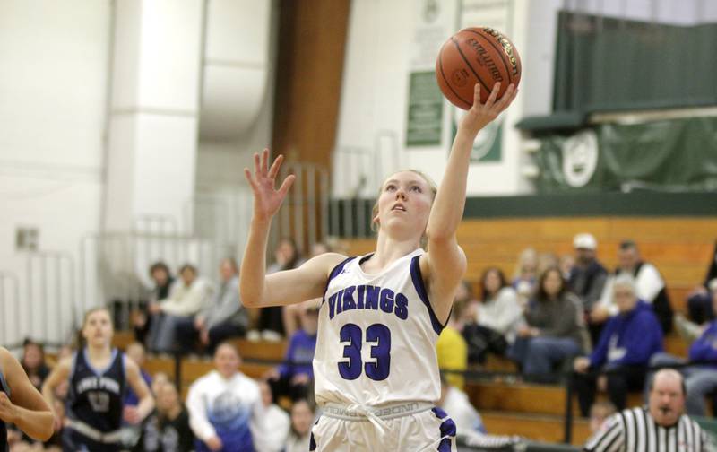 Geneva’s Lauren Slagle gets a shot up during a Class 4A Glenbard West Sectional semifinal game against Lake Park in Glen Ellyn on Tuesday, Feb. 21, 2023.