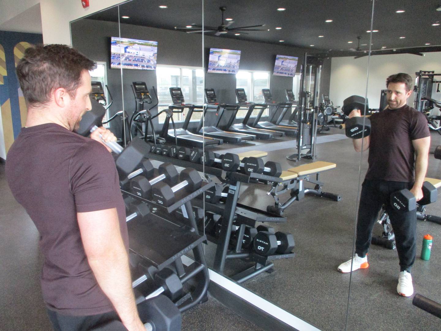 New resident Chris Sutter exercises in the weight room in the clubhouse at the The View apartments at Rock Run Collection in Joliet. May 6, 2026