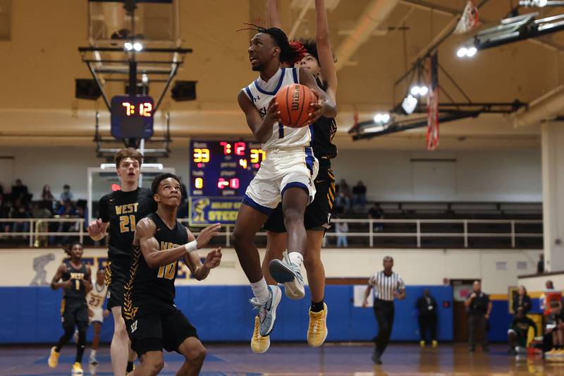 Joliet Central’s Jamarcho Holman goes in for the basket against Joliet West on Saturday, Jan. 27th, 2024 in Joliet.