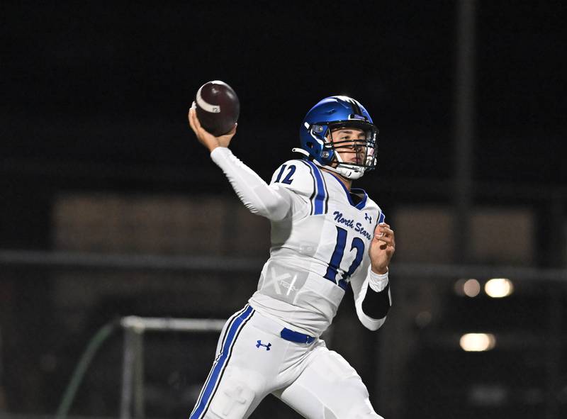 St. Charles North's Jesse Padron (12) throws the deep ball during the non-conference game against Minooka on Friday, August. 29, 2025, at Minooka.