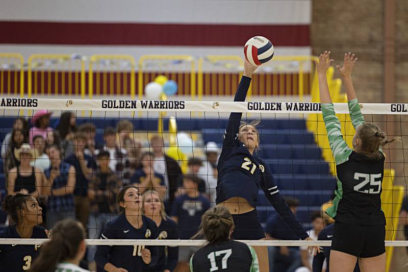 Sterling’s Kirra Gibson works the net against Alleman’s Megan Hulke Monday, Sept. 18, 2023.