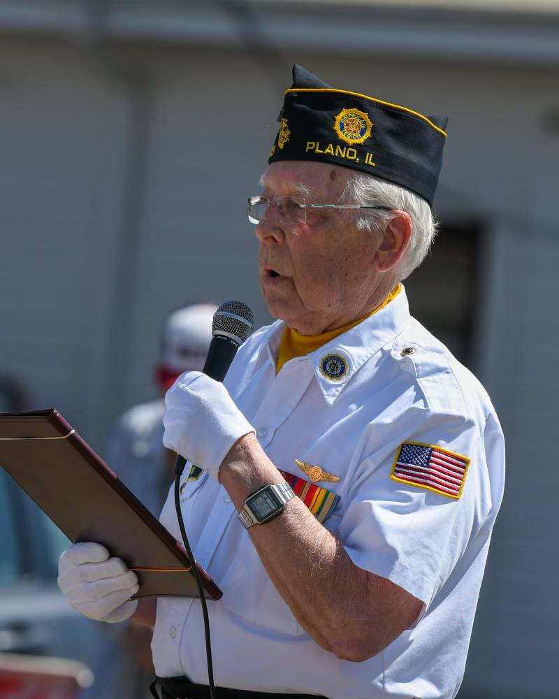 Art Killey of the Plano VFW talks during the Memorial Day ceremony held at Memorial Park in Plano on Monday, May 29, 2023.