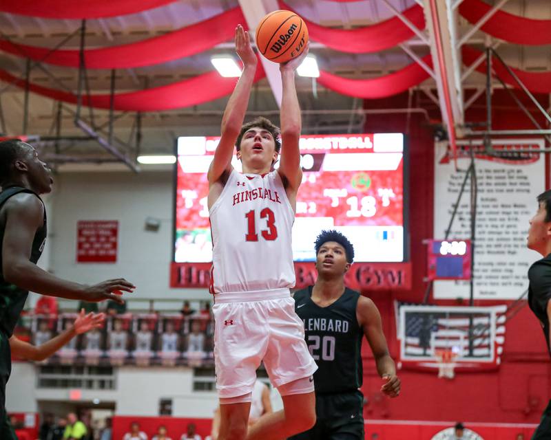 Hinsdale Central's Michael Howell (13) puts up a shot in front to the basket during their basketball game between Glenbard West at Hinsdale Central, Friday  Dec 6, 2024  in Hinsdale.