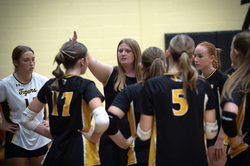 Herscher's head coach Joslyn Galeaz talks with her team during a timeout in a match against Clifton Central on Monday, September 29, 2025.