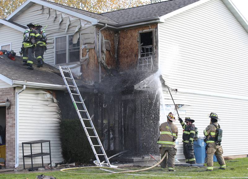 Oglesby, Peru Tonica and Utica fire departments spray water on a home to extinguish a fire at a duplex home in the 200 block of Sunset Boulevard on Tuesday, Oct. 24, 2023 in Oglesby. Two occupants were evacuated safely from the residence. The fire happened shortly after 11a.m. It was extinguished about an hour later.