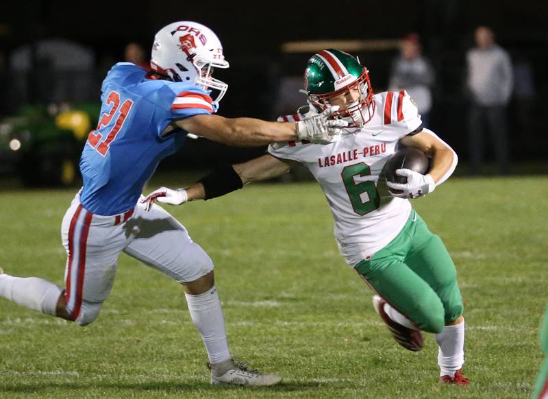 Ottawa's Jace Vieth grabs the facemask of L-P's Adrian Arzola on Friday, Oct. 4, 2024 at King Field.