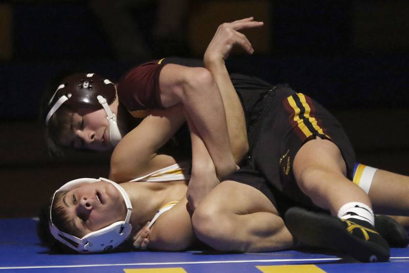 Richmond-Burton’s Lelan Nelson tries to pin Johnsburg’s Kai Surdick in the 106-pound match of a Kishwaukee River Conference wrestling meet on Thursday, Jan. 30, 2025, at Johnsburg High School.