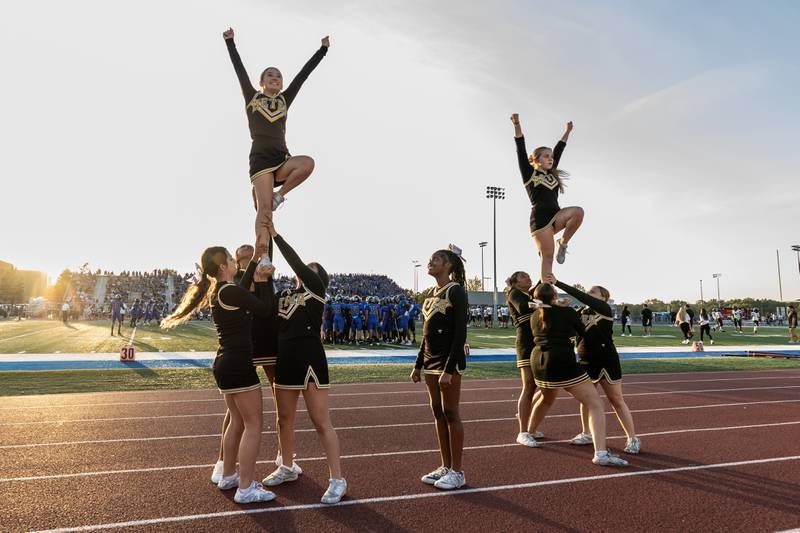 Metea Valley’s varsity cheer team share school spirit prior to a varsity football game against Lincoln-Way East at Lincoln-Way East on Oct. 3, 2025.