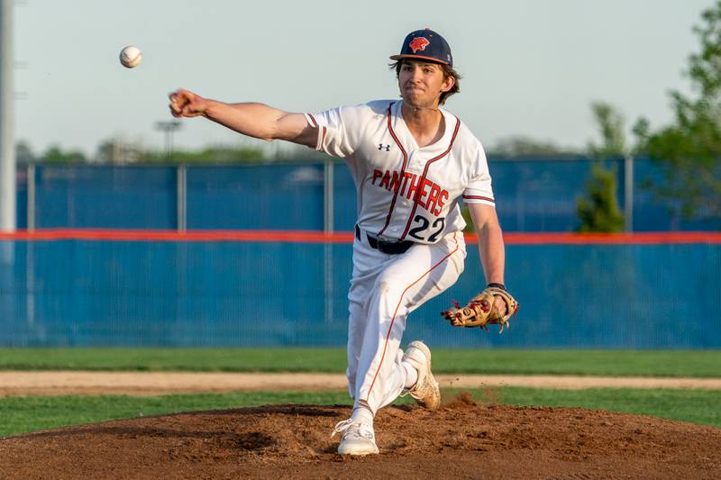 Oswego’s Edward Scaccia (22) delivers a pitch against Oswego East during a baseball game at Oswego High School on Tuesday, May 9, 2023.