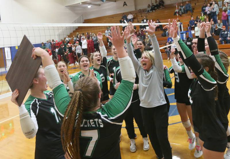 Members of the Rock Falls volleyball team hoist the Class 2A Sectional plaque after defeating Illinois Valley Central in the Class 2A Sectional final game on Wednesday, Nov. 1, 2023 at Princeton High School.