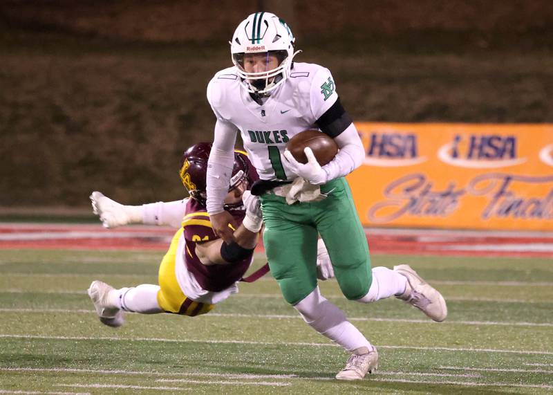 York’s Bruno Massel gets by Loyola Academy's Quinn Drehkoff during their Class 8A state championship game Saturday, Nov. 30, 2024, in Hancock Stadium at Illinois State University in Normal.
