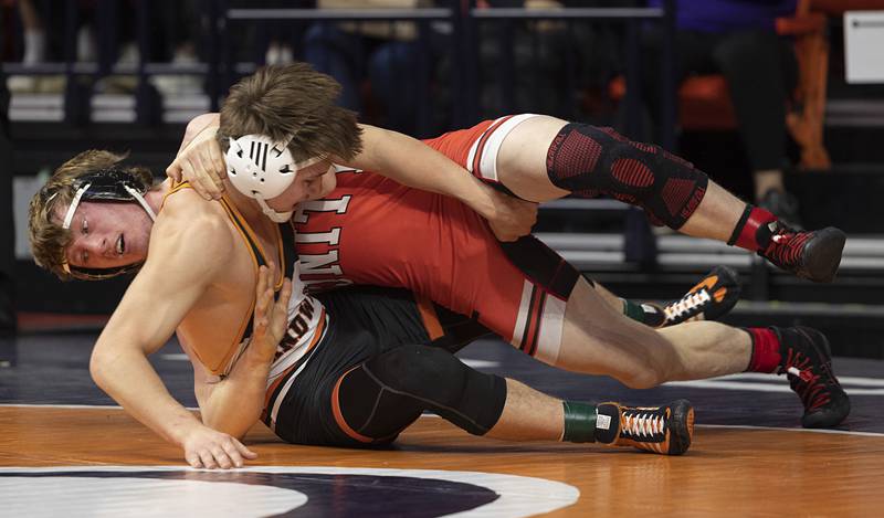 Cooper Corder of Sandwich (right) and Unity Christian’s Clinton VerHeecke compete in the 1A 150 pound title match Saturday, Feb. 21, 2026, at the IHSA wrestling finals in Champaign. Corder took the win.