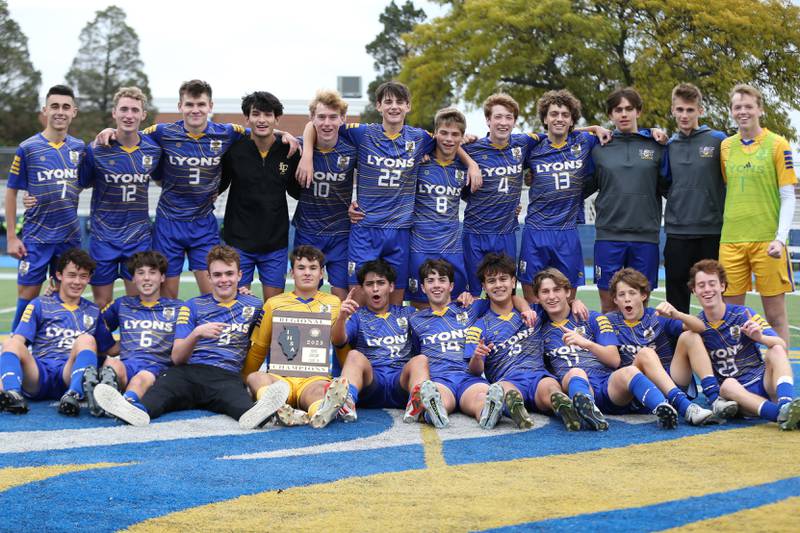 Lyons poses with the Class 3A Lyons Regional final plaque after defeating Downers Grove North.  Oct 21, 2023.
