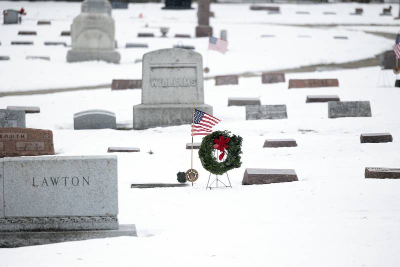 One of 92 wreaths placed on headstones of veterans Saturday, Dec. 13, 2025, in Dixon.