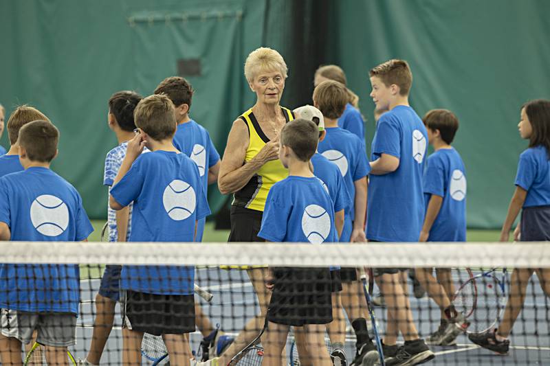 Westwood tennis instructor Carolyn Allen quizzes her students on parts of the court during a free tennis clinic Thursday, June 29, 2023.