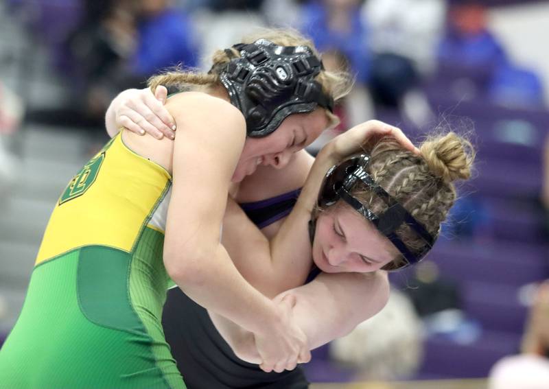 Crystal Lake South’s Annalee Aarseth, left, battles Hampshire’s Stella Piazza at 115 pounds in varsity girls IHSA Regional Championship wrestling action on Saturday, February 7, 2026, at Hampshire High School in Hampshire.