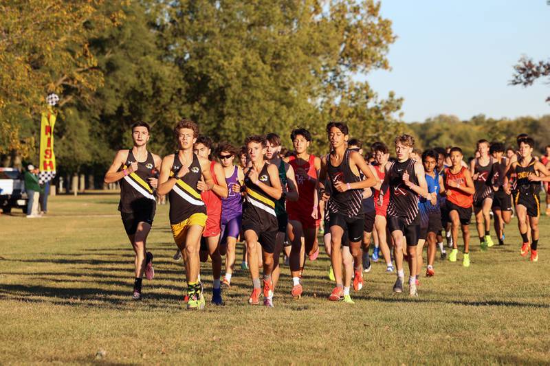 Runners take off on the first stretch in the boys 3-mile race during All-Area Cross Country meet on Wednesday, Oct. 8, 2025, at Kankakee Community College.