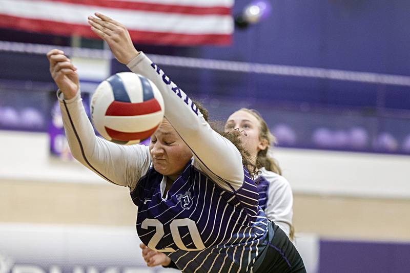 Dixon’s Olivia Cox misplays a shot that went off the ceiling against Rock Falls Thursday, Oct. 12, 2023 at Dixon High School.
