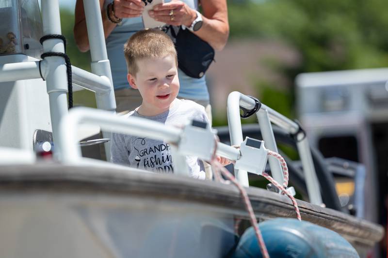 Child plays on boat at the Touch a Truck event on Saturday, June 28, 2025 at Centennial Park in Peru.