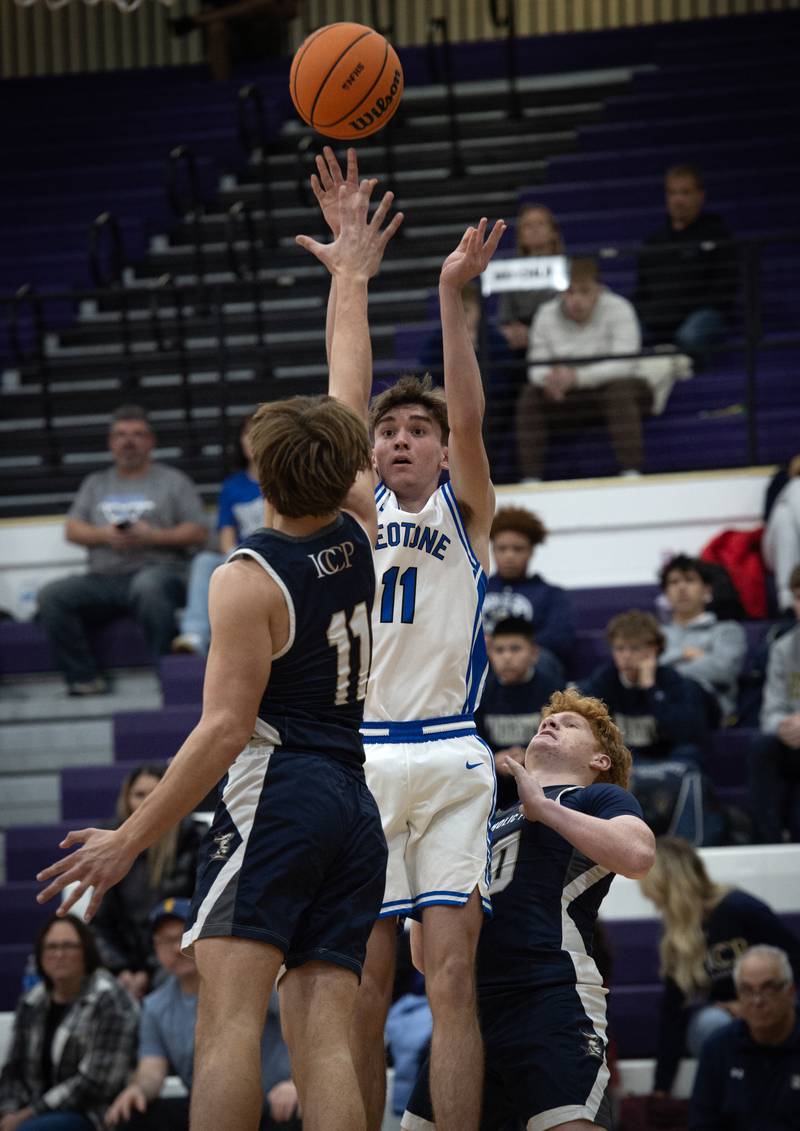 Peotone's Adam Murray takes a shot as IC Catholic's Grant Bowen defends in the Thanksgiving tournament at Manteno High School on Monday, November 24, 2025.