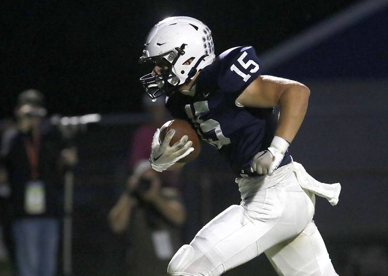 Cary-Grove's Jake Hornok scores a touchdown after catching a Peyton Seaburg pass during a Fox Valley Conference football game against Prairie Ridge on Friday, Sept. 22, 2023, at Cary-Grove High School in Cary.